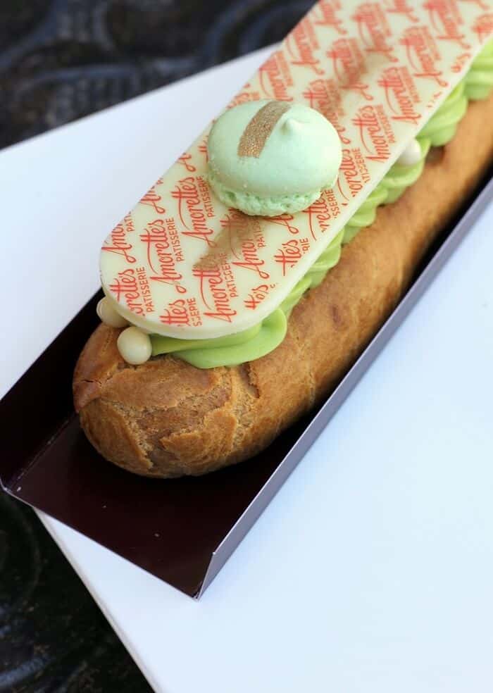 Pistachio eclair from Amorette's Patisserie at Disney Springs in Walt Disney World. #pistachio #eclair #patisserie #disneysprings #waltdisneyworld #wdw #travelguide