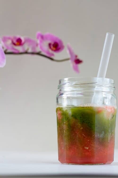 Pink and green layered drink with watermelon puree and matcha